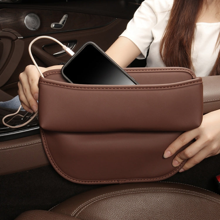 Car seat crevice storage box, mocha brown open top holding a phone and charging cable