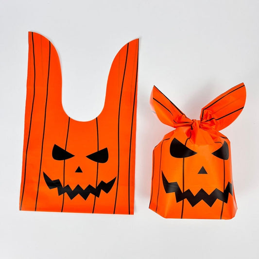 Halloween treat gift bags, orange jack-o-lantern face print, one large and one small