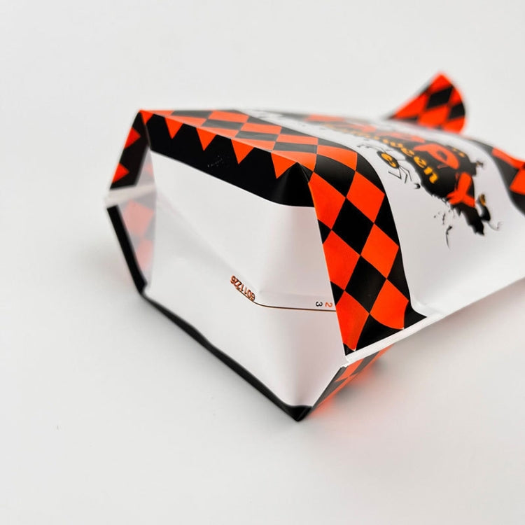 Halloween treat gift bag, white with orange-and-black check pattern and cartoon jack-o-lantern