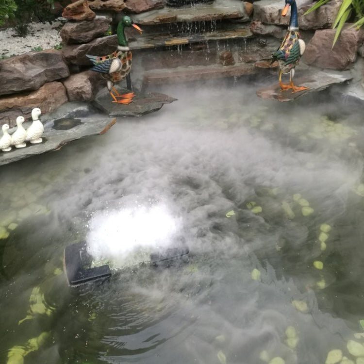 Landscape pond covered with dense white fog from an ultrasonic fog maker