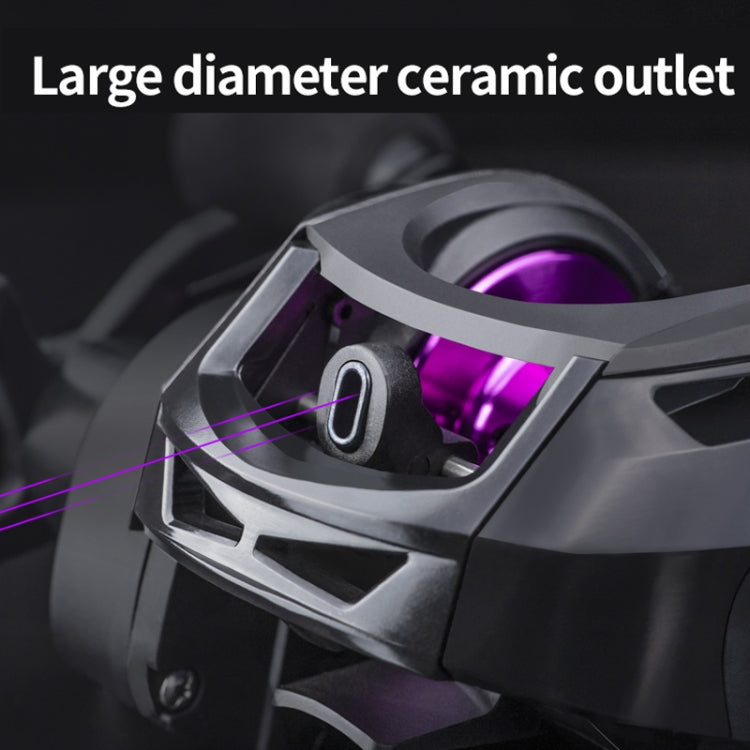 Baitcasting reel close-up with large outlet ring and visible purple spool interior.