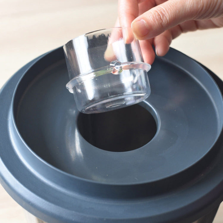 100ml measuring cup dosing cap fitted into sealing lid on Thermomix base