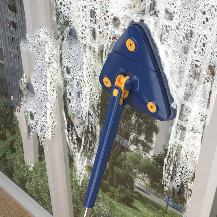Blue triangular mop cleaning window glass with extendable pole and gray pad
