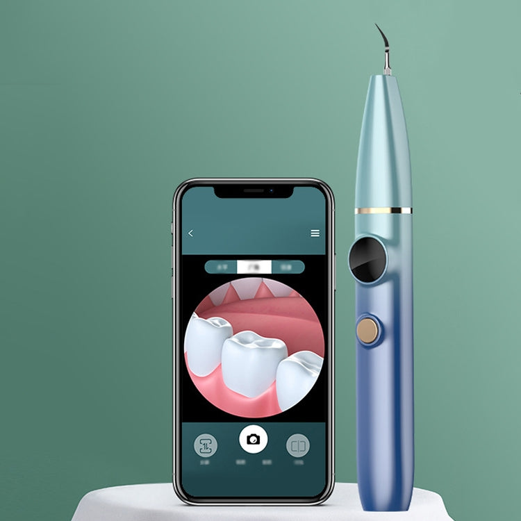 Blue visual ultrasonic dental scaler beside smartphone display screen