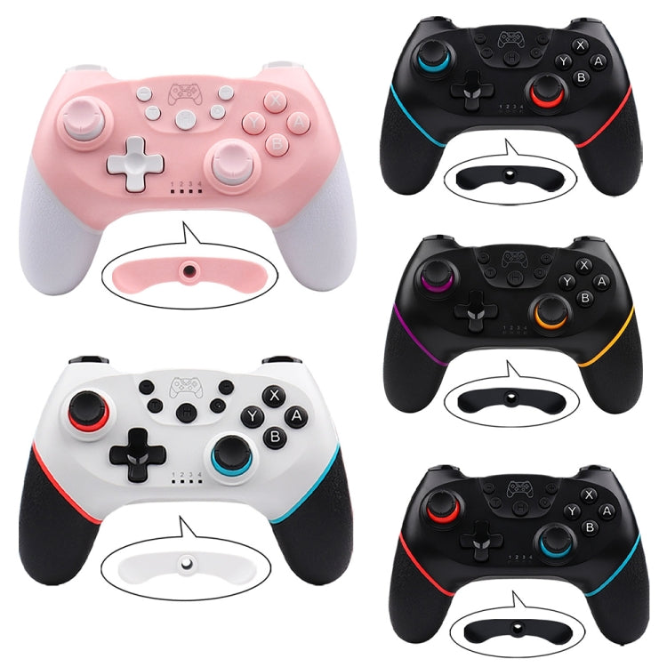 Set of Nintendo Switch Pro wireless controllers in pink, white, and black with colored accents