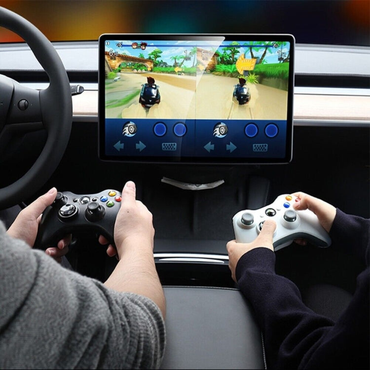 Connected USB charging hub in car interior near dashboard screen and controllers