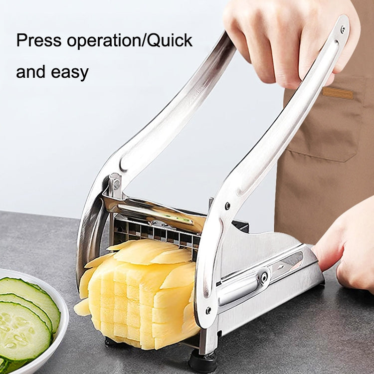 Hand pressing stainless steel fries cutter on a board with sliced potatoes