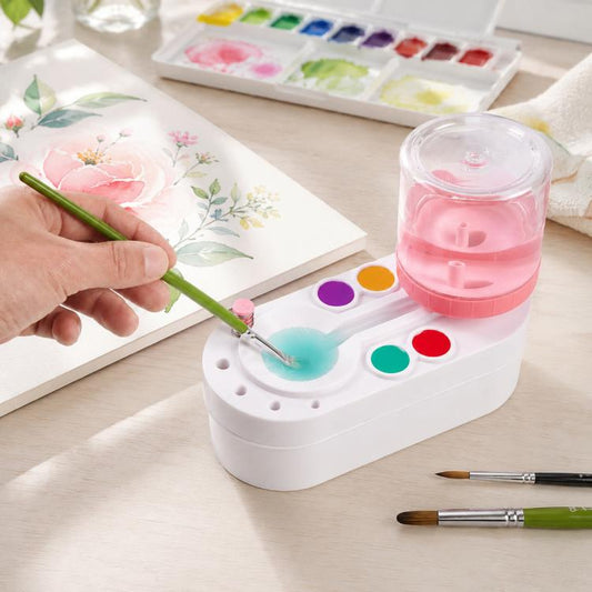 Pink water container brush cleaner with green handle and multi-color paint rinse wells