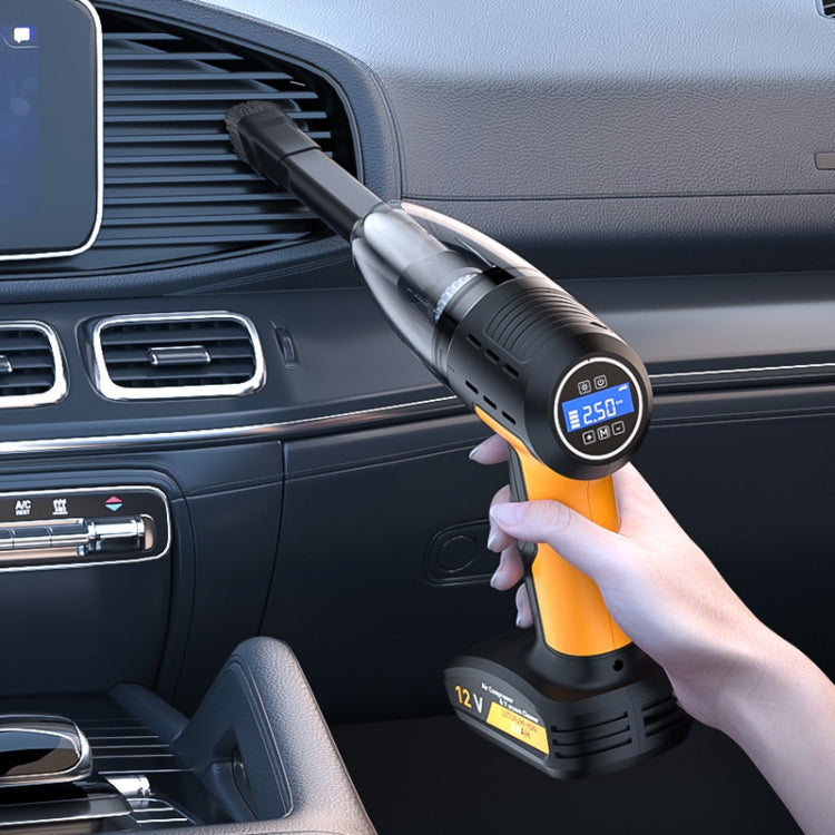 Yellow and black handheld car vacuum cleaner with nozzle, held in hand in car interior