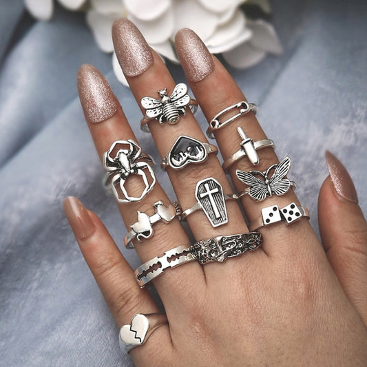 12-piece open stack ring set with heart, cross, butterfly, spider, and mushroom charms