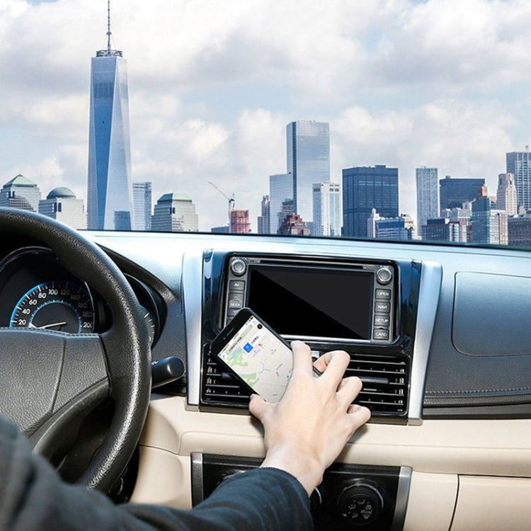 Air-vent magnetic phone holder holding a smartphone on the car vent mount