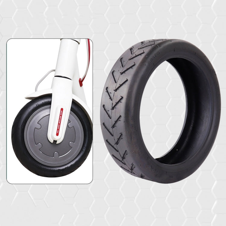 Outer tire shown beside an electric scooter wheel for fit reference