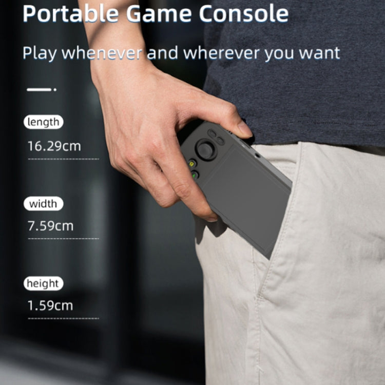 Gray handheld game console held in hand, buttons and analog controls visible