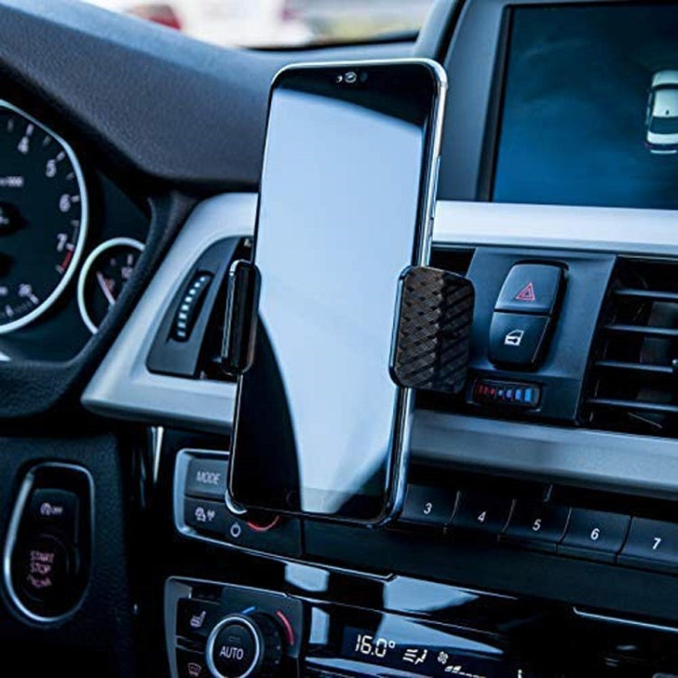 Black car air vent phone holder holding a smartphone with swivel clamp grip