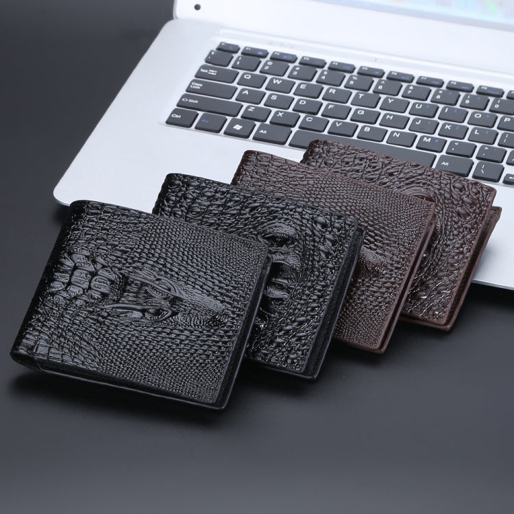Men’s crocodile-print short wallets stacked together in dark tones.