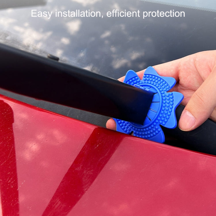 Blue universal wiper protective cover installed on windshield wiper arm, close-up