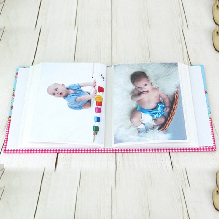 Pocket photo album open, showing two square photo inserts with colorful corner accents