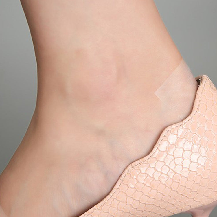 Clear anti-wear heel patch adhesive on the back of a shoe-worn heel area