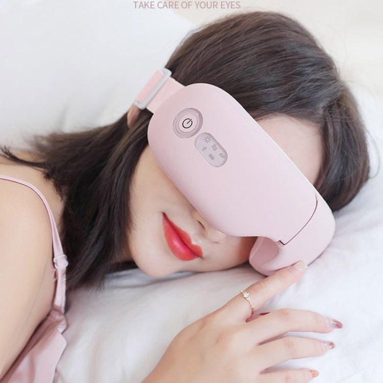 Pink rechargeable eye massager with heated pads and air pressure, showing control buttons