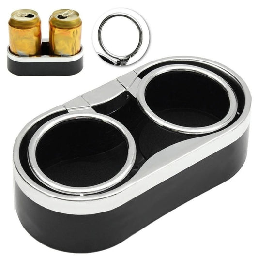 Double car dashboard cup holder with two chrome-trimmed openings and small accessory ring