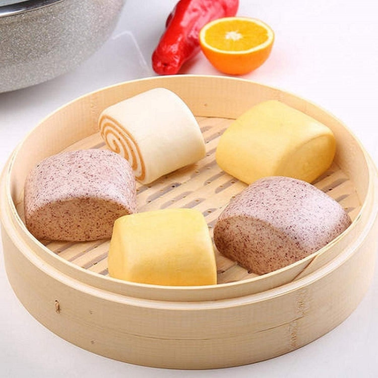 Bamboo steamer basket with slatted insert, holding assorted buns