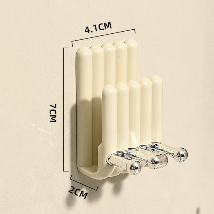 Cream wall-mounted toothbrush holder with chrome hooks; compact 7x4.1x2 cm size.