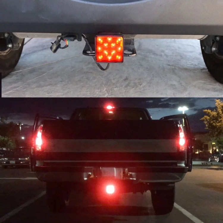 Universal LED trailer rear brake light glowing red on a vehicle rear