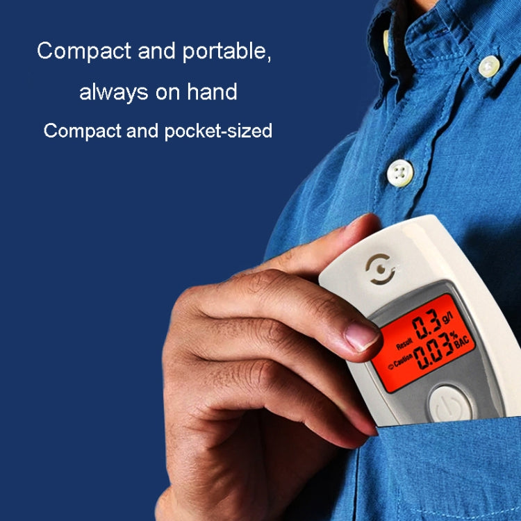 Handheld breath alcohol tester held in hand, orange digital display visible