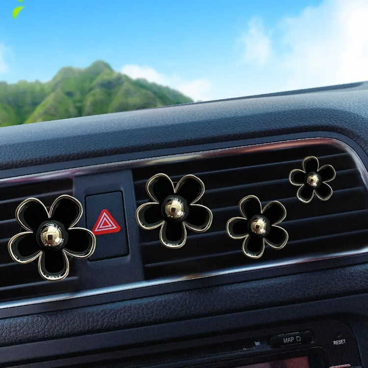 Chrysanthemum air vent clip decoration set on car dashboard vents with gold-tone centers