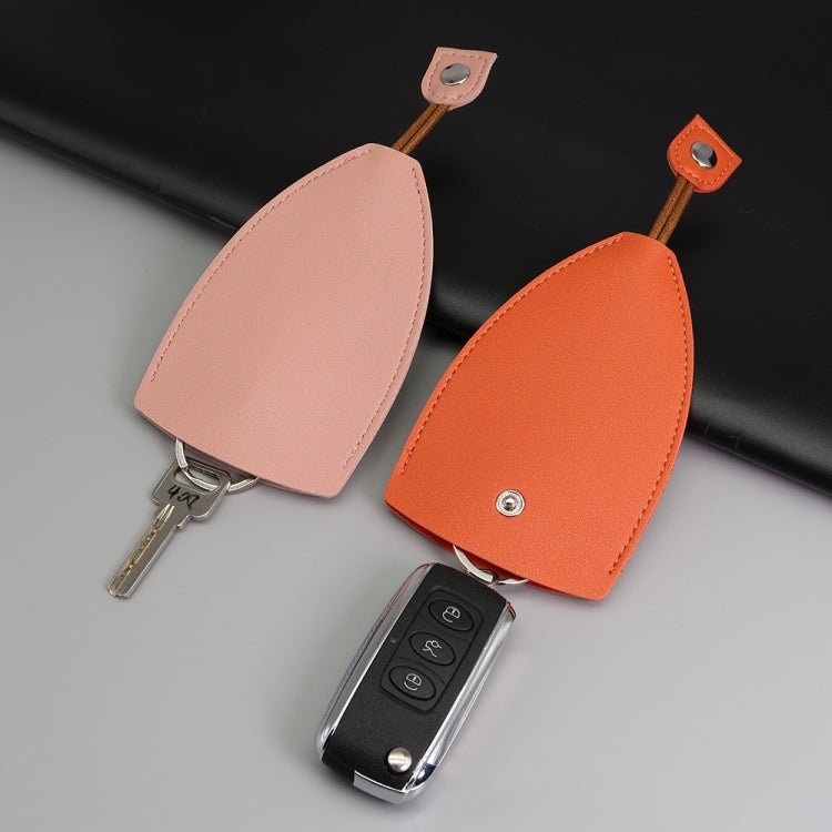 Personalized car key bag set with light pink and orange covers, plus black key cover and keys