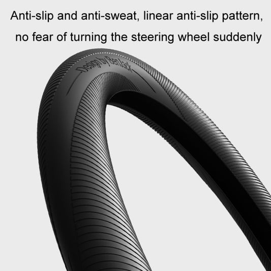 Black silicone steering wheel cover with linear anti-slip and anti-sweat grip texture.