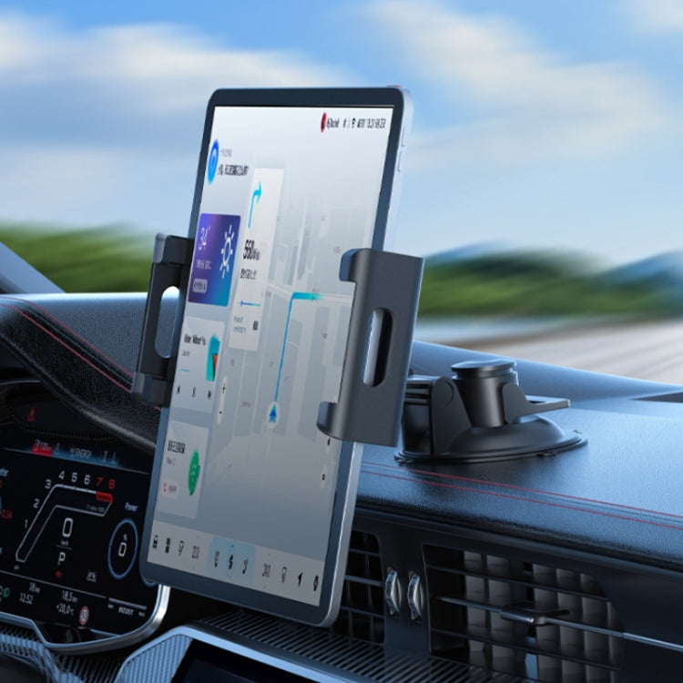 Car dashboard phone holder with folding clamp holding a smartphone vertically