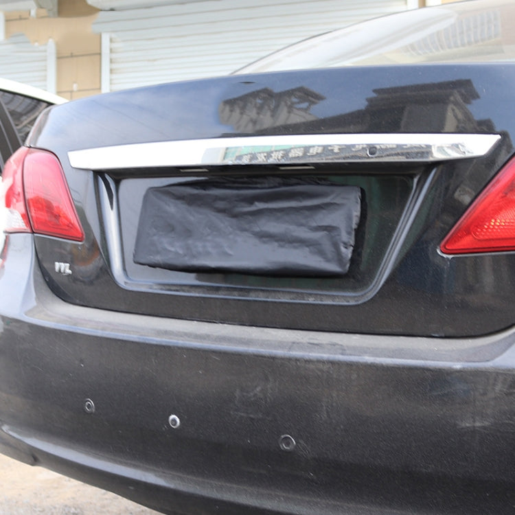 Car rear license plate with black waterproof cover installed