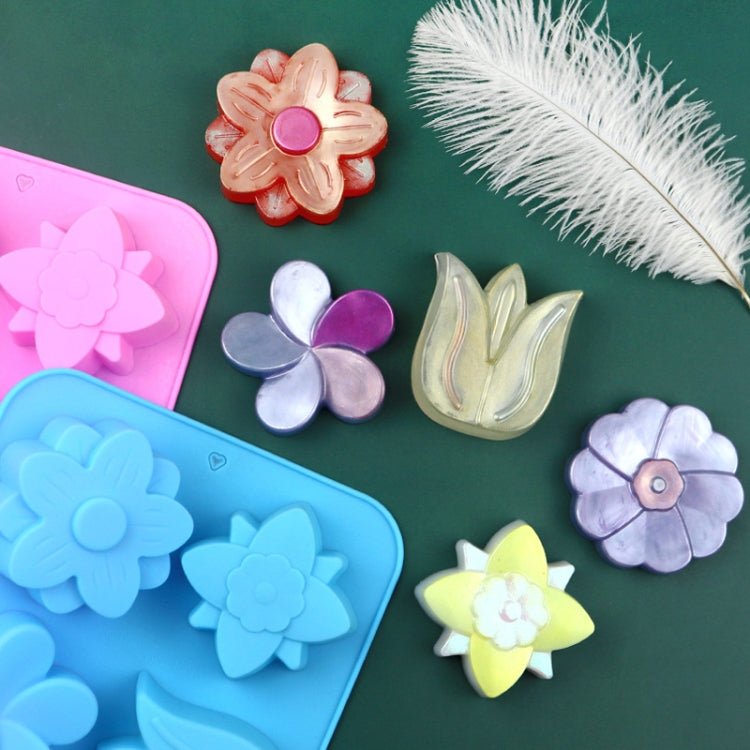Set of silicone flower cake molds in pink and blue, with embossed blossom shapes