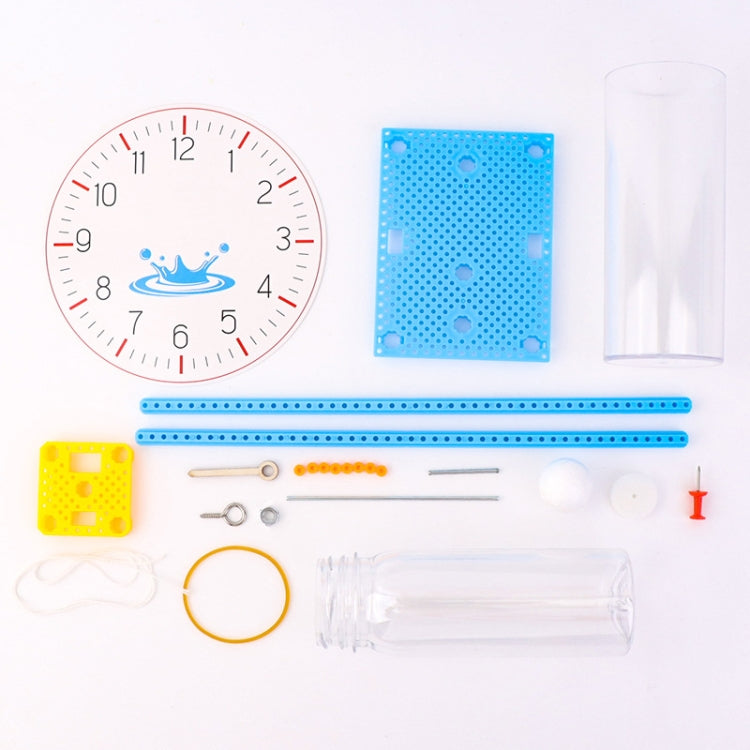 Water-drop clock kit parts: clock dial, blue base plate, rods, and clear cylinder
