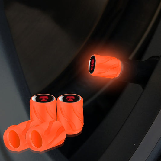 Luminous tire valve cap set of 4, orange-red caps with red skull emblem, glowing