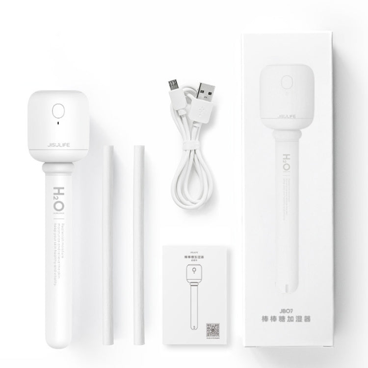 White handheld humidifier with charging cable, stand, and adapter accessories