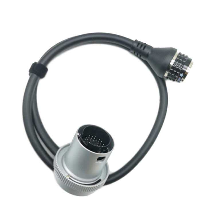 Diagnostic cable with silver round connector and metal-plug end on black wire