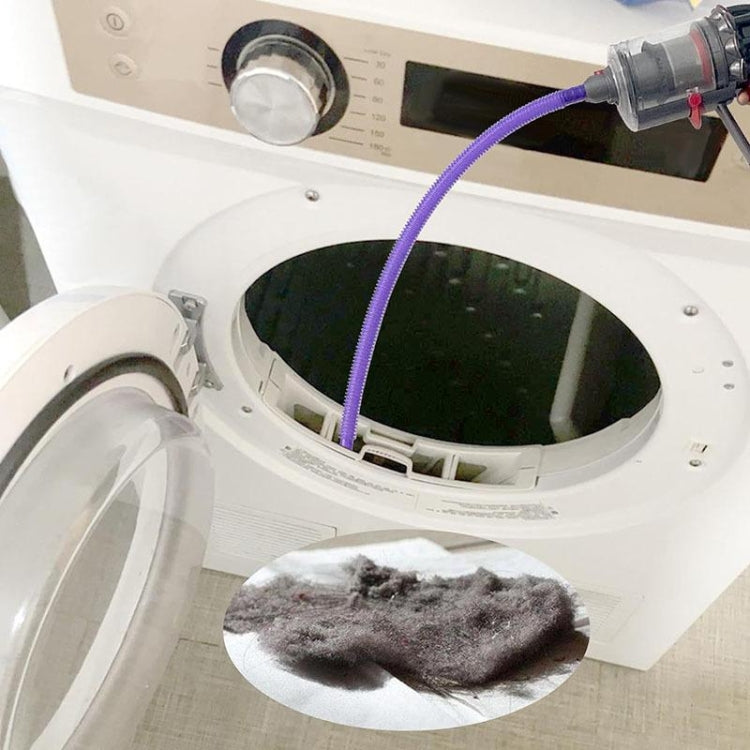 Vacuum dryer vent cleaner kit attachment with purple hose at dryer drum opening