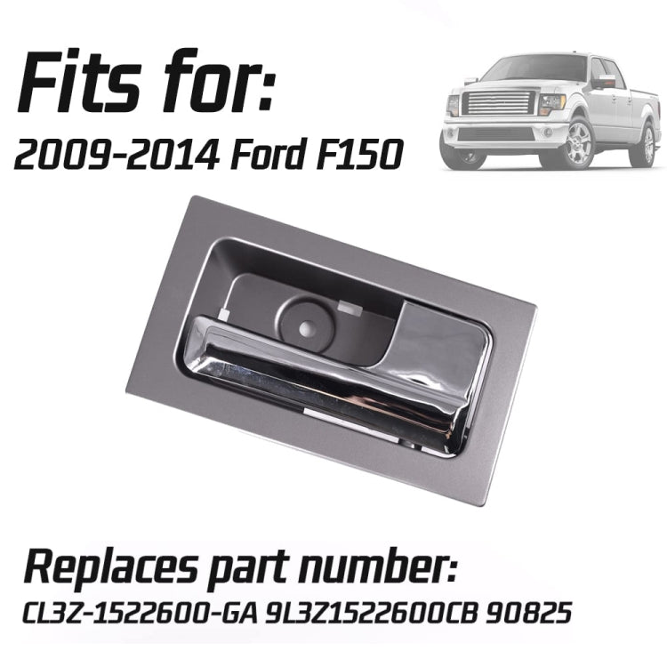 Interior door handle with chrome pull and gray rectangular bezel trim