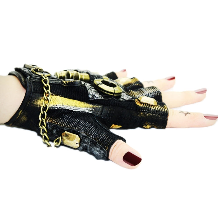 Hands wearing fingerless biker gloves with black-and-gold studs and chain wrist detail