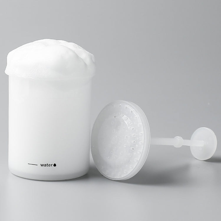 White manual foaming cleanser cup with foaming head and pump bulb