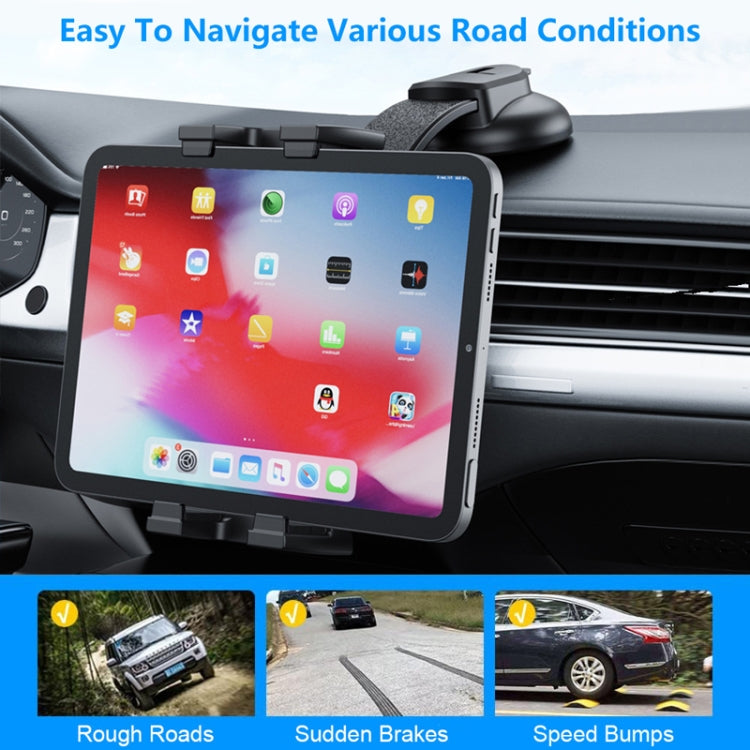 Car dashboard tablet holder with suction base and clamp arms securing a tablet