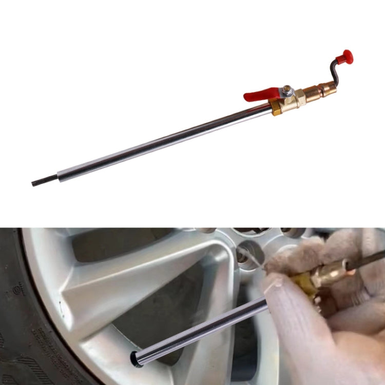 Universal air filling rod with metal valve connector and red lever inserted on a tire