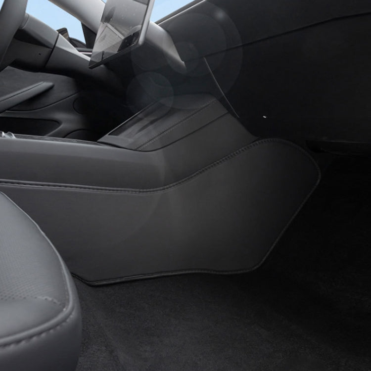 Installed anti-kick protective pad on Tesla center console side, dark suede texture