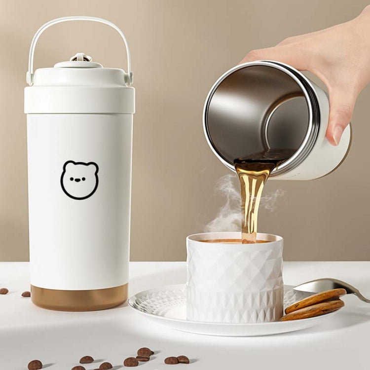 White insulated stainless steel travel mug with straw and lid, carry handle