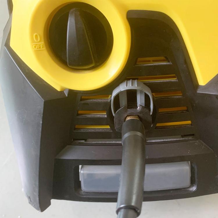 Pressure washer inlet area with yellow control housing and black sealing ring connector