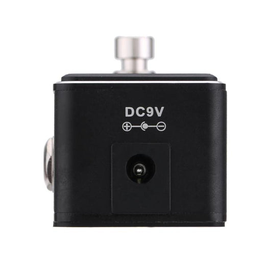 Black tuner pedal back panel with DC9V label and round power input