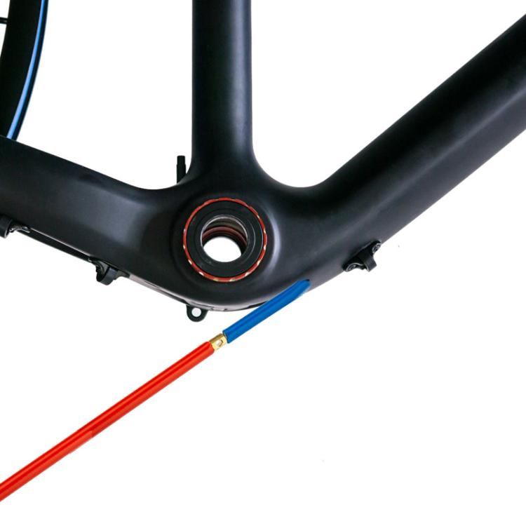 Bicycle frame area with installed hose fitting and red O-ring around the port