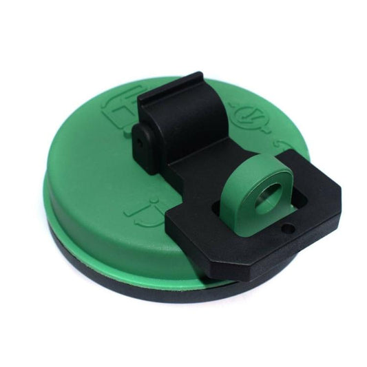 Green fuel cap with black hinged latch and circular opening